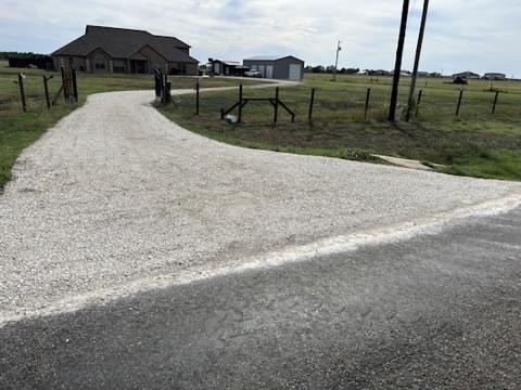 Long curving gravel driveway installation