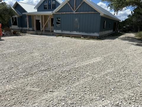 New construction with finished gravel pad in central Texas